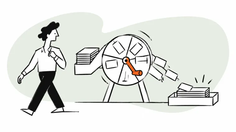 A person walks away while a mechanical wheel sorts cards into a tray.